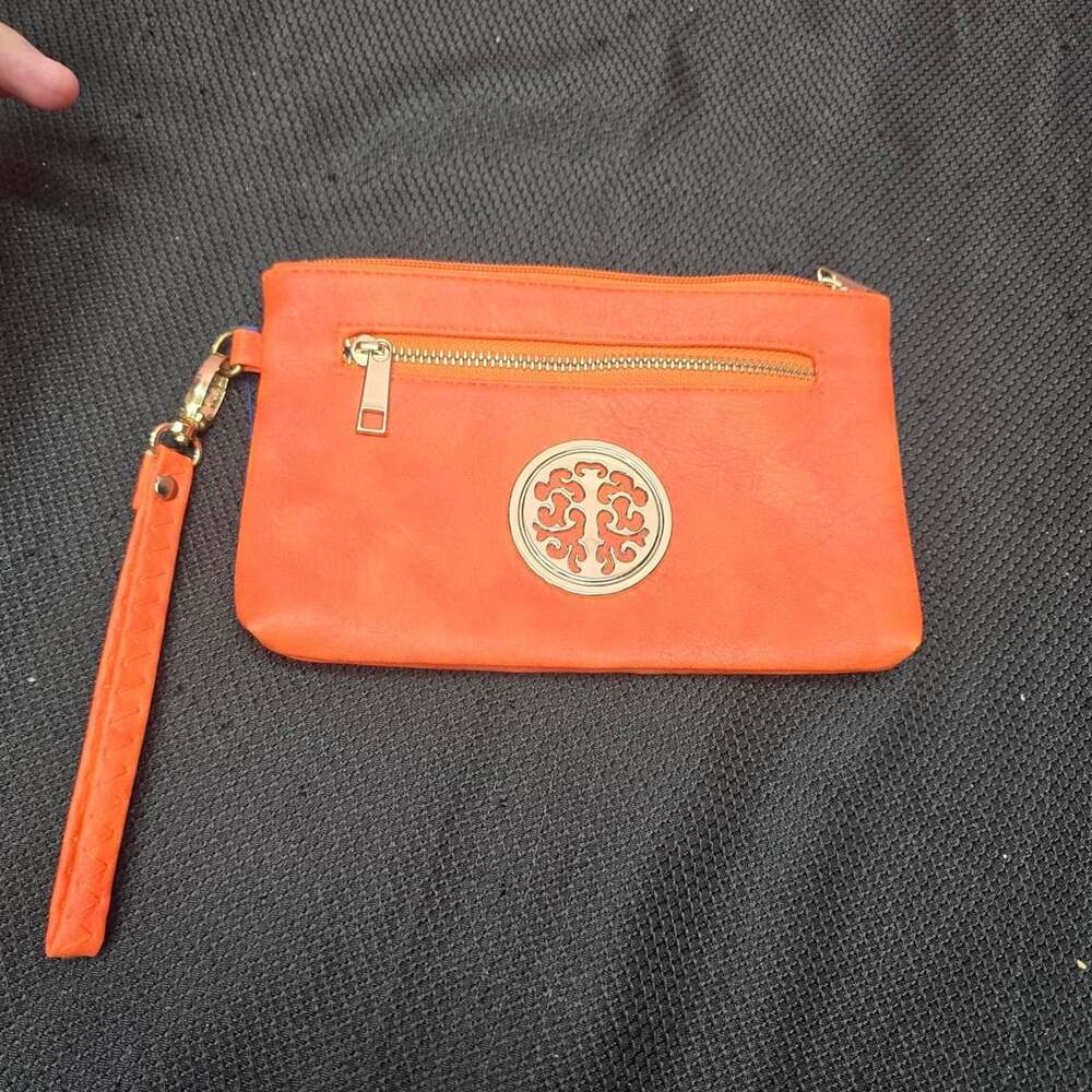 Orange Wristlet Bag with Gold Medallion Accent